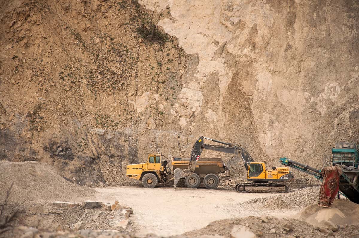 image of an excavator at rock quarry commercial stone suppliers in Southern California