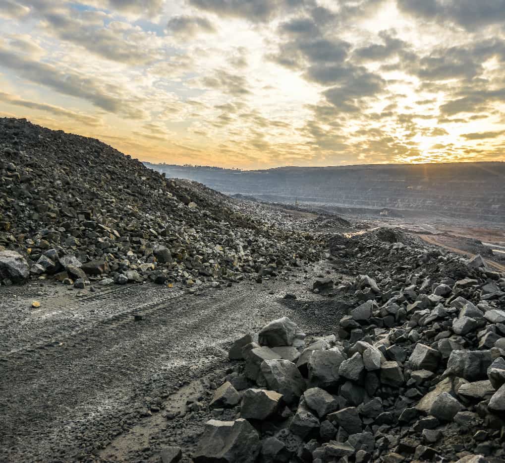 image of a large quantity of boulders at the end of a road for finding bulk granite rock for a project