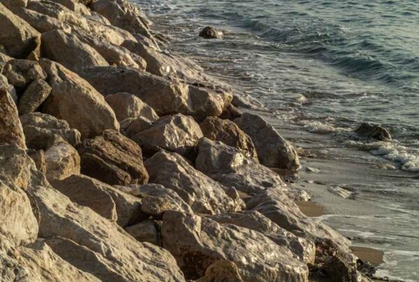 Large rip rap rocks protecting a shoreline from erosion