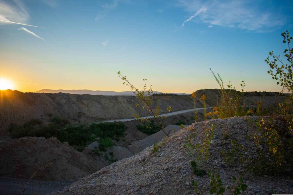 Gravel quarry and crushed rock landscape at sunset